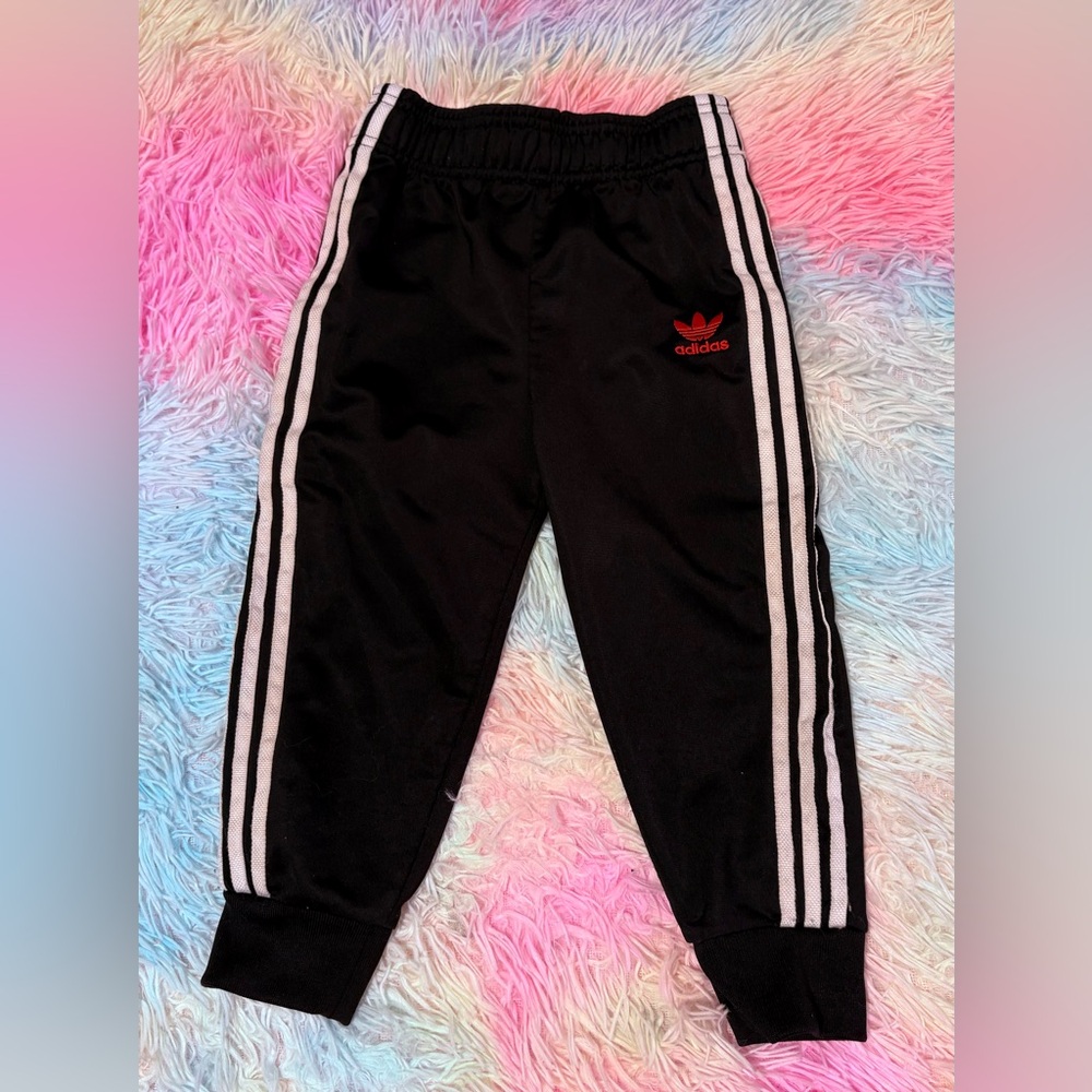 Adidas Kids Black Joggers with Red Logo

Buy 4 items and get 25% off